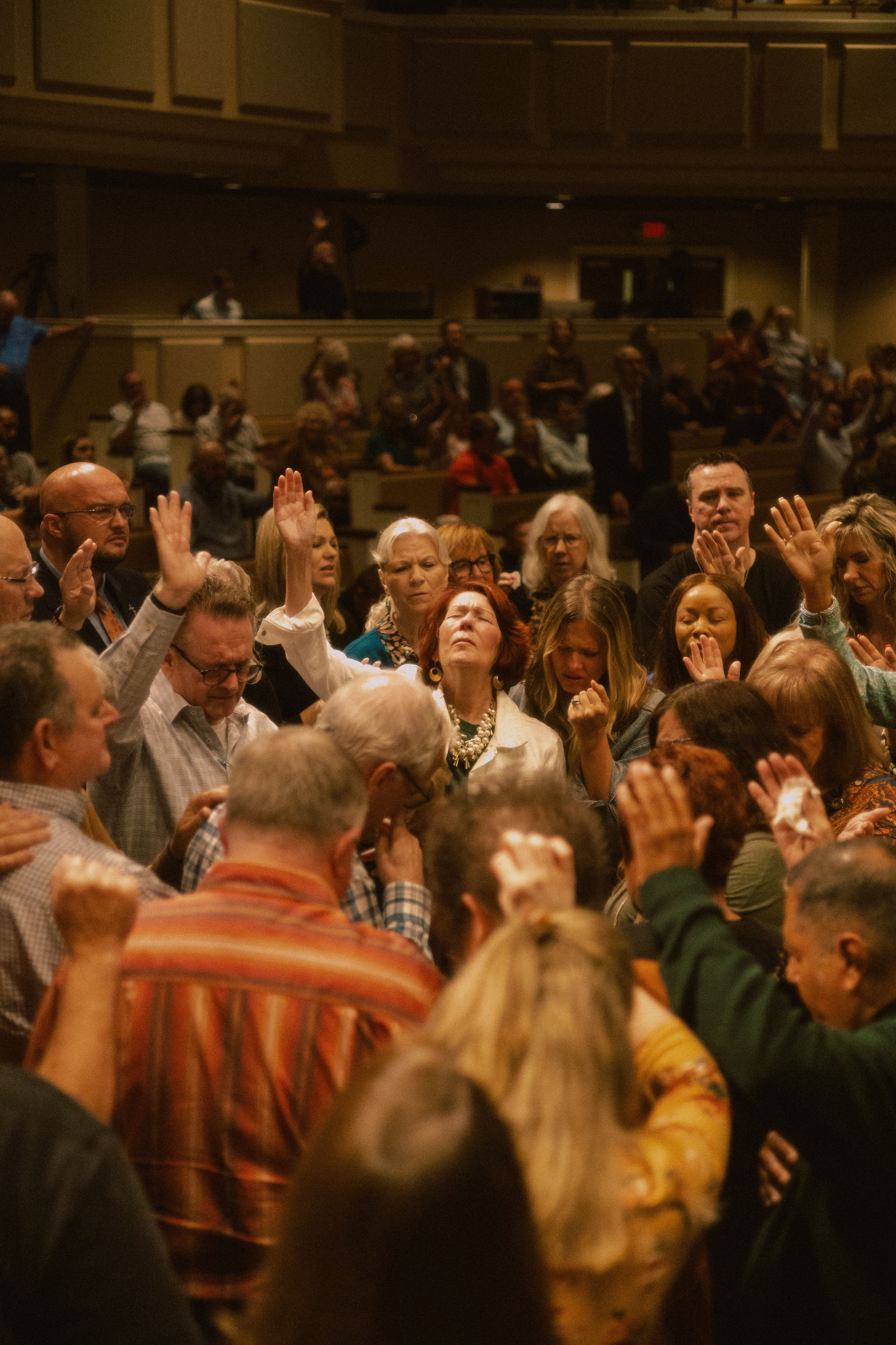 A church community gathered together in worship and prayer